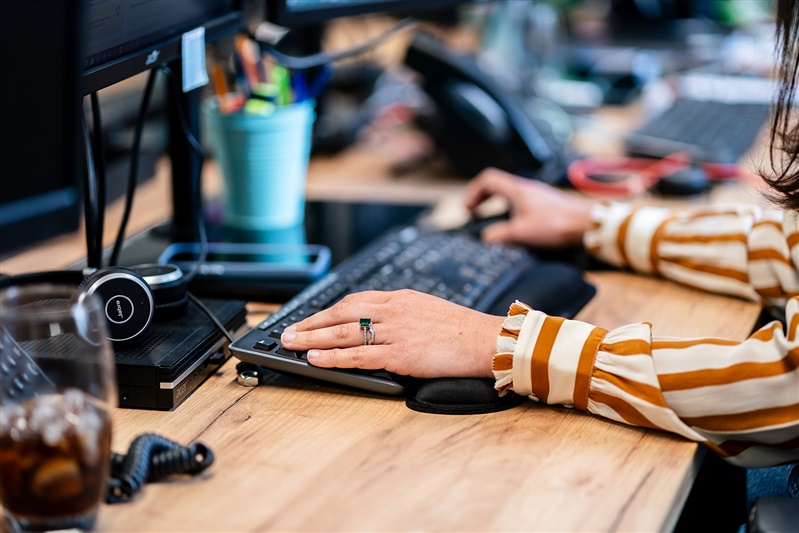 Hands typing on keyboard