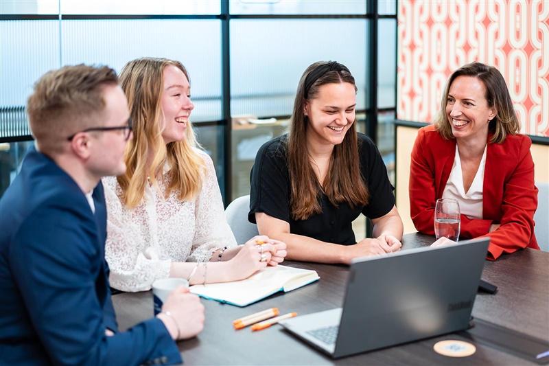 Four colleagues in a meeting