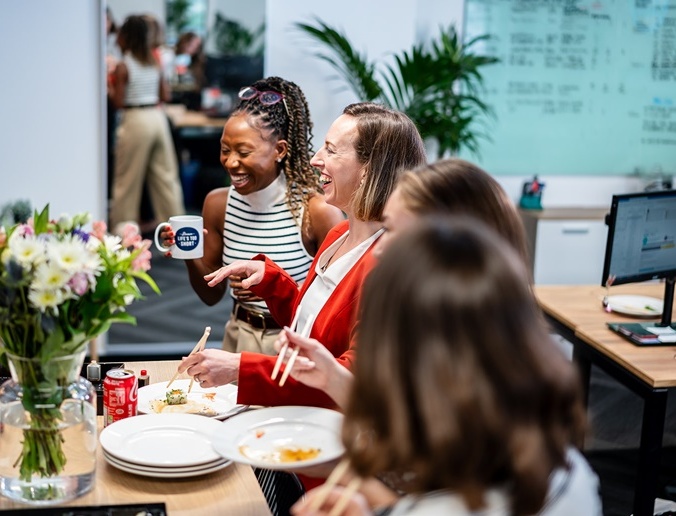 Women laughing having lunch
