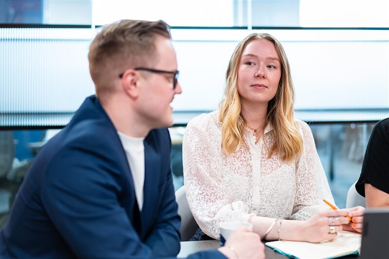 Man and woman in a meeting in bright office